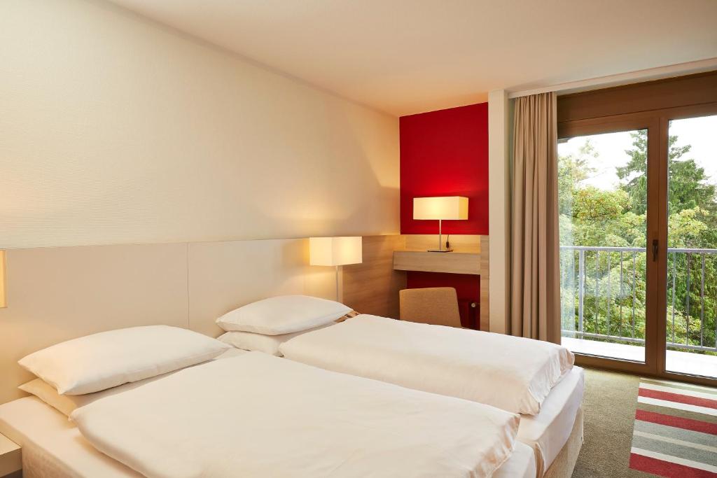 Comfortable hotel room with private balcony